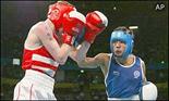 England's Darran Langley is narrowly beaten to light flyweight gold by Indian Mohammed Ali Qamar