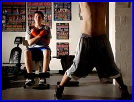 'Bazooka' Joe Linenfelser, 17, left, works out his abs at Sweet Science boxing gym in New Port Richey. He just may be the youngest professional boxer in the U.S.