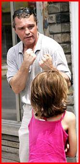 Former world boxing champion Dave Hilton Jr. spars with his step-daughter Melissa Shatilla outside his father's boxing club after his release from prison, in Montreal on Monday June 19, 2006. (CP / Ian Barrett)